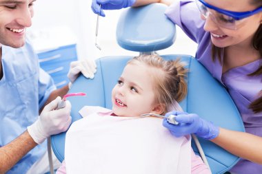 Girl at the dentist clipart