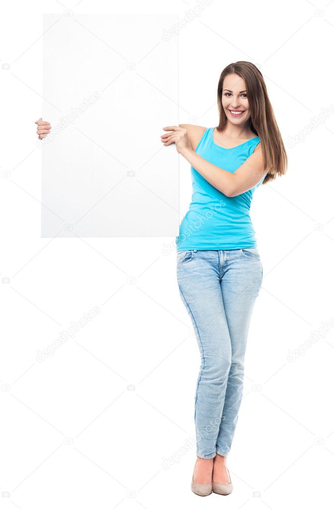 Attractive young woman with blank sign