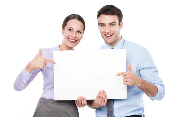 Business couple holding a placard — Stockfoto