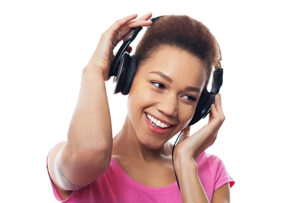 Woman listening to headphones — Stock Photo, Image