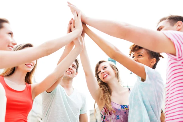 Friends joining hands — Stock Photo, Image