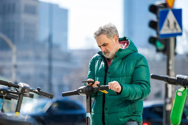 Mature Man Activating Electric Scooter Smartphone — Stock Photo, Image