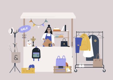 A thrift shopping concept, a Sunday market stand with used clothes and accessories