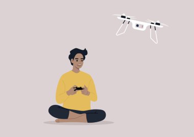 Uzaktan kumandalı İHA uçuran genç bir erkek karakter. Yeni teknolojiler.