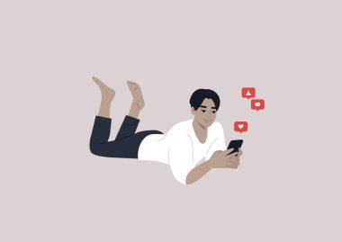 A young male Asian character lying on their stomach and checking their mobile phone notifications
