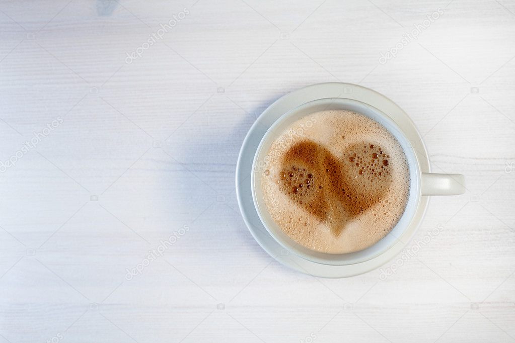 Morning cup of coffee with heart shape