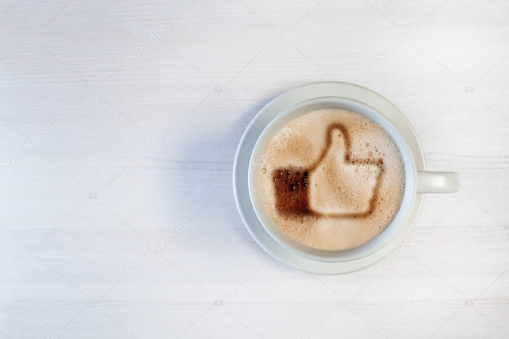 Cup of coffee with 'like' symbol