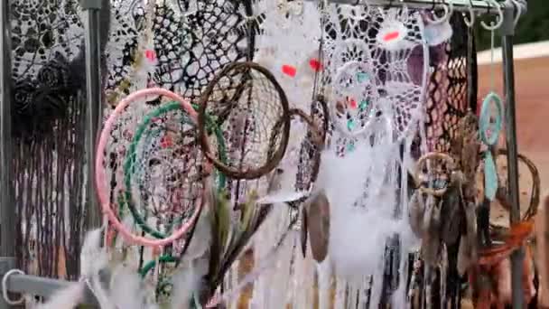 Many Different Amulets Dreamcatcher Swinging Wind Beautiful Multicolored Feathers Flying — Stock Video