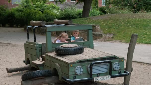 Boy Girl Playing Playground Homemade Wooden Jeep Car Concept Happy — Stock Video