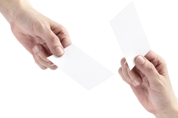 Two hands exchanging blank bussiness cards — Stock Photo, Image