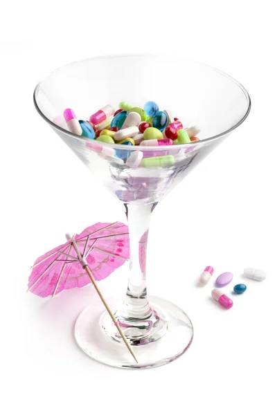 Cocktail glass with medicines — Stock Photo, Image