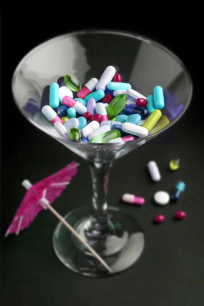 Cocktail of drugs in a glass — Stock Photo, Image