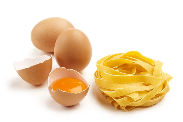 Fettuccine nest with eggs — Stock Photo, Image