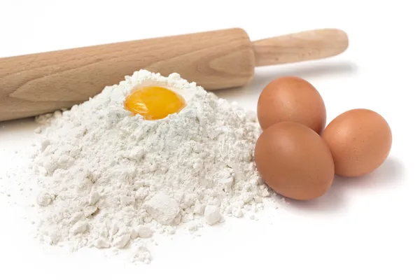 Flour, eggs and rolling pin — Stock Photo, Image