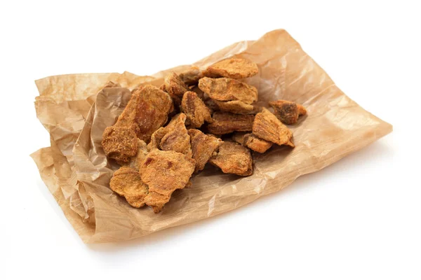 Pieces of dried meat on paper bag — Stock Photo, Image