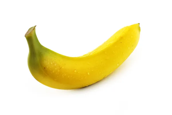 Närbild på en banan med droppar på vit bakgrund — Stockfoto