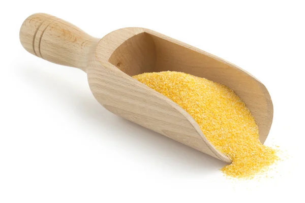 Wooden scoop with cornmeal on white background — Stock Photo, Image