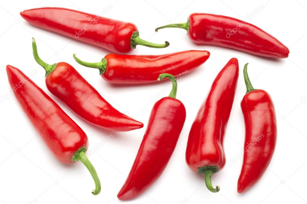 group of red chilies on white background