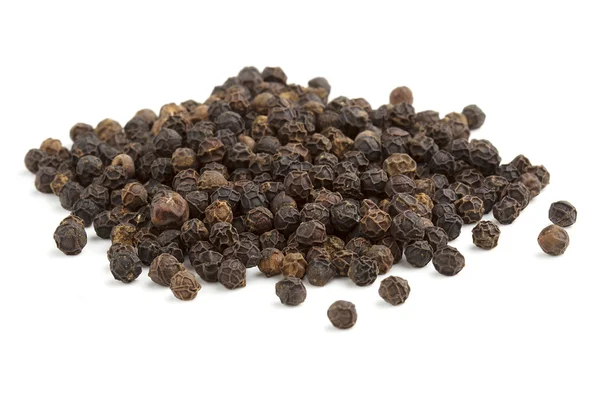Heap of black peppercorns on white background — Stock Photo, Image