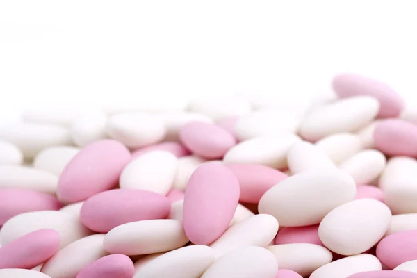 Heap of white and pink sugared almonds — Stock Photo, Image