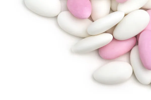 Heap of white and pink sugared almonds — Stock Photo, Image