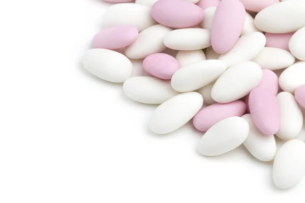 Heap of white and pink sugared almonds — Stock Photo, Image