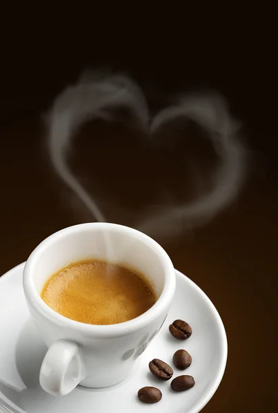 Coffee cup with steam in shape of heart — Stock Photo, Image