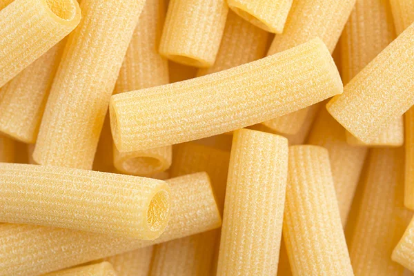 Close up of traditional italian pasta, raw macaroni — Stock Photo, Image