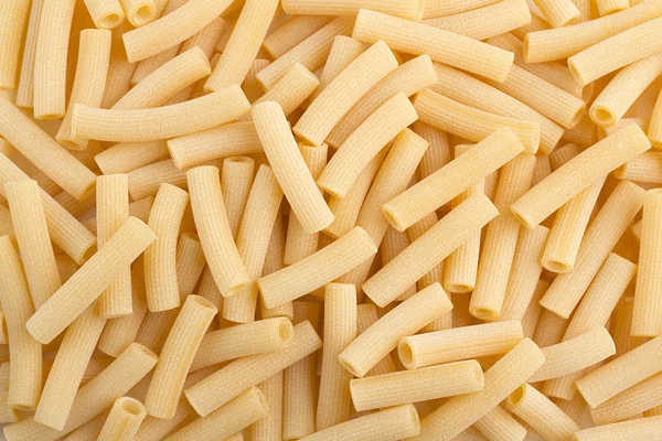 Background, italian raw pasta, macaroni — Stock Photo, Image