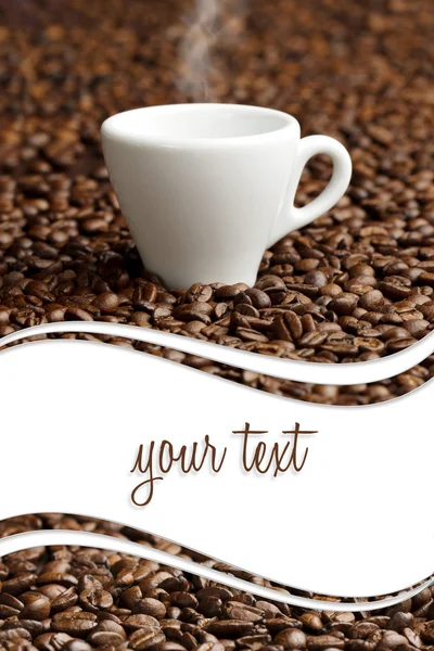 Steaming cup on background of coffee beans with copy space — Stock Photo, Image