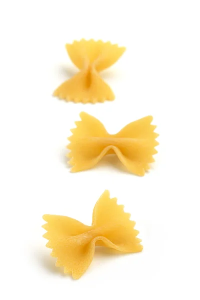 Three bow tie pasta on white background — Stock Photo, Image