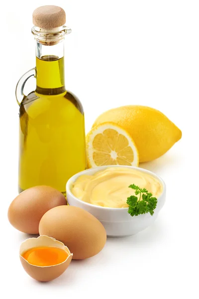 Mayonnaise ingredients: olive oil, eggs and lemon — Stock Photo, Image