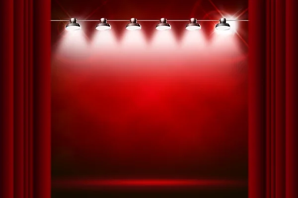 Червоний фон, освітлений прожекторами і блискітками — стокове фото