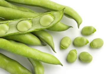 Broad bean pods and seeds on white background clipart
