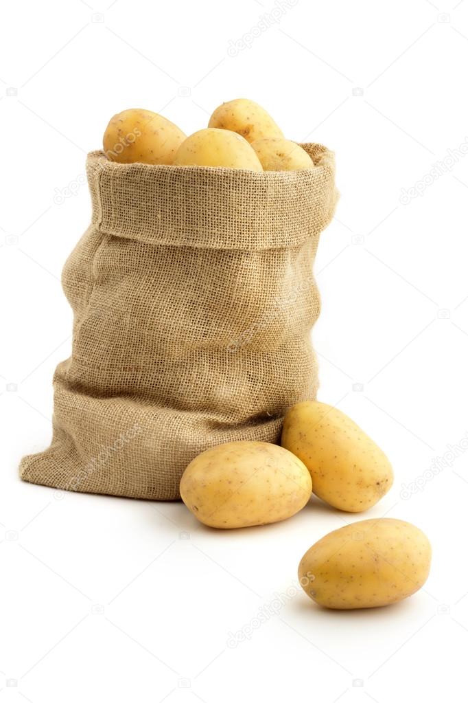 Jute sack full of yellow potatoes on white background