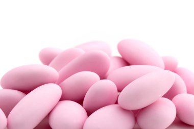 Close up of a heap of pink sugared almonds clipart