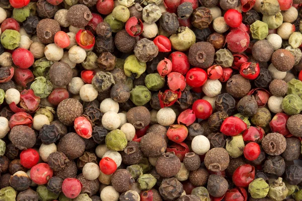 Close up van een achtergrond van veelkleurige peppercorn mix — Stockfoto