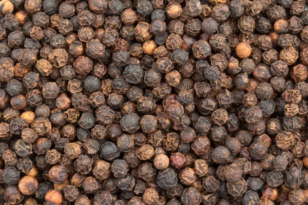 Close-up de um fundo de pimenta preta — Fotografia de Stock