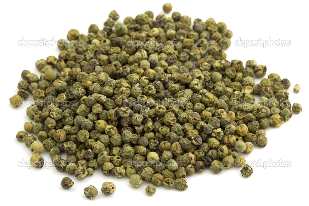 Heap of green peppercorns isolated on white background