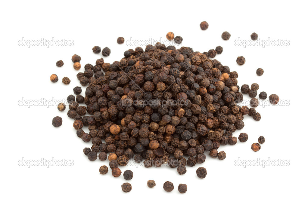 Heap of black peppercorns isolated on white background