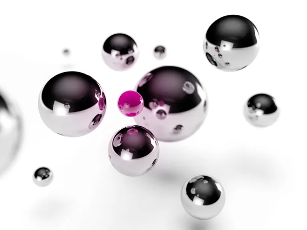 Steel balls surrounding a small pink sphere — Stock Photo, Image