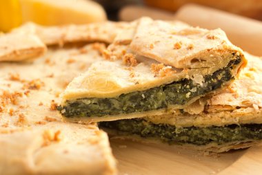 Close up of a slice of spinach pie clipart