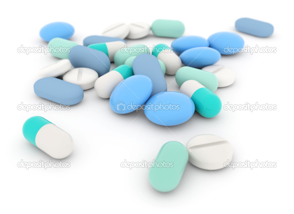 Heap of pills and tablets on white background