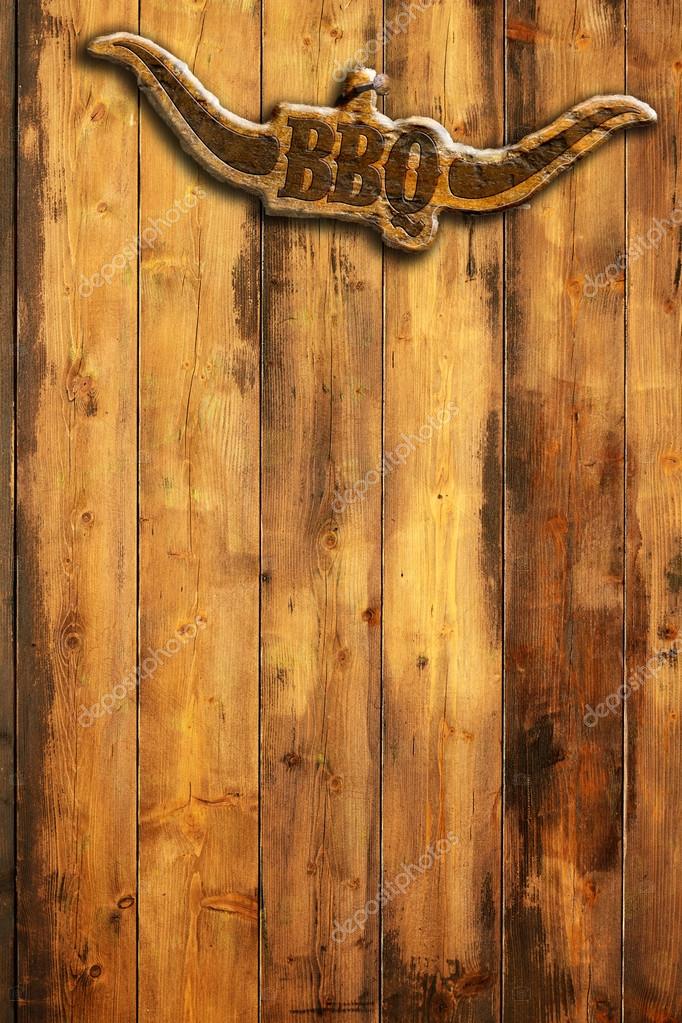 Barbecue insignia with horns on a wooden wall