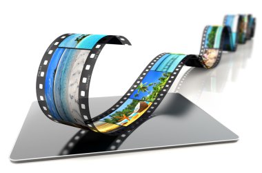 Film şeridi tropikal imge üstünde a laptop ile