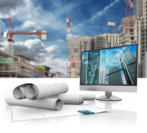 Blueprints, computer and calculator in a construction site — Stock Photo, Image