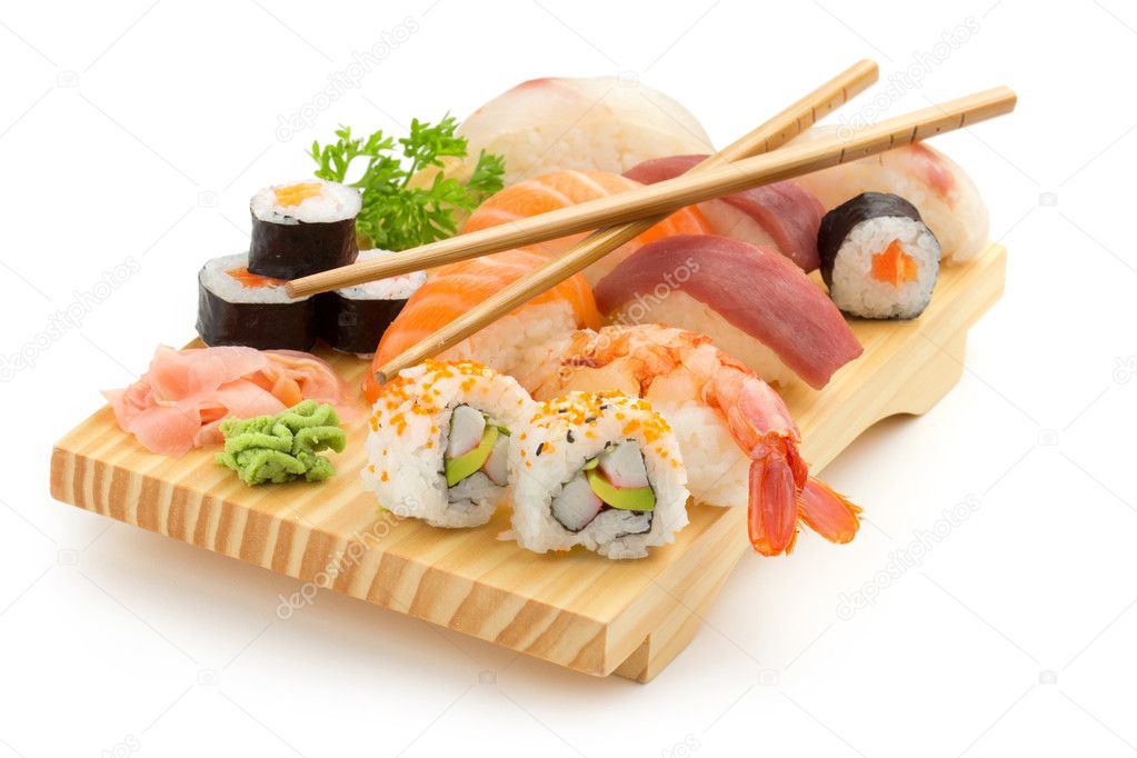 Japanese seafood sushi and chopsticks on wooden plate