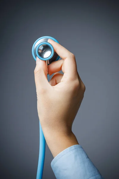 Close Female Hand Holding Stethoscope Isolated Grey Background Routine Medical — Stockfoto