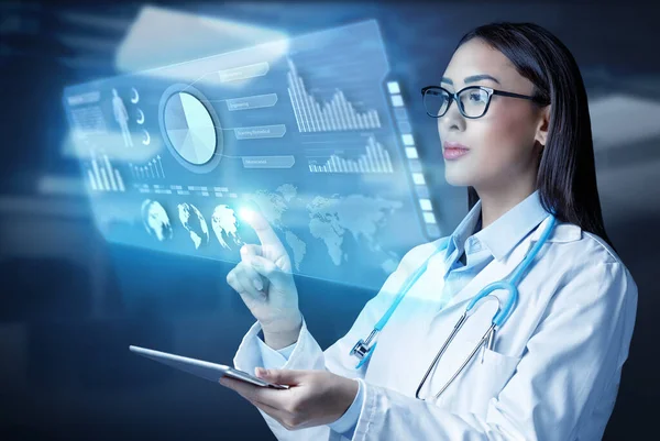 Female Doctor Holding Tablet Computer Touching Medical Graphs Virtual Screen — Fotografia de Stock