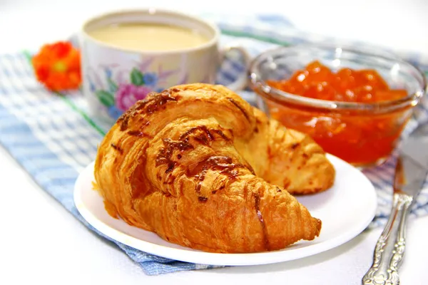 Apricot jam, white coffee and croissant — Stock Photo, Image